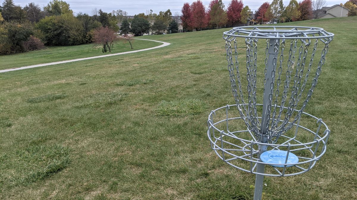 Tee #3. (Basket 2). Hole is past curve of sidewalk on the right