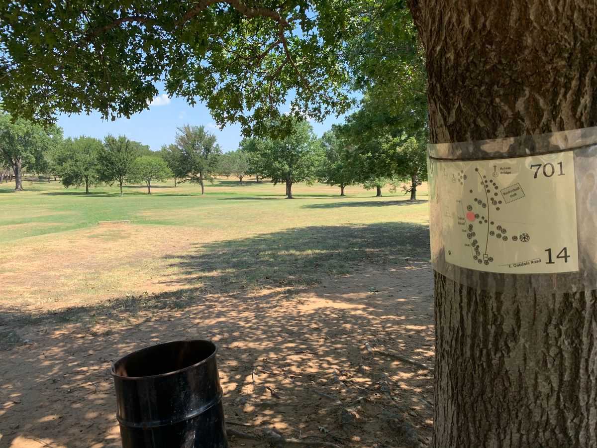 Hole 14. Longest hole on the course. Across a small canal. Stay left of the basketball courts.