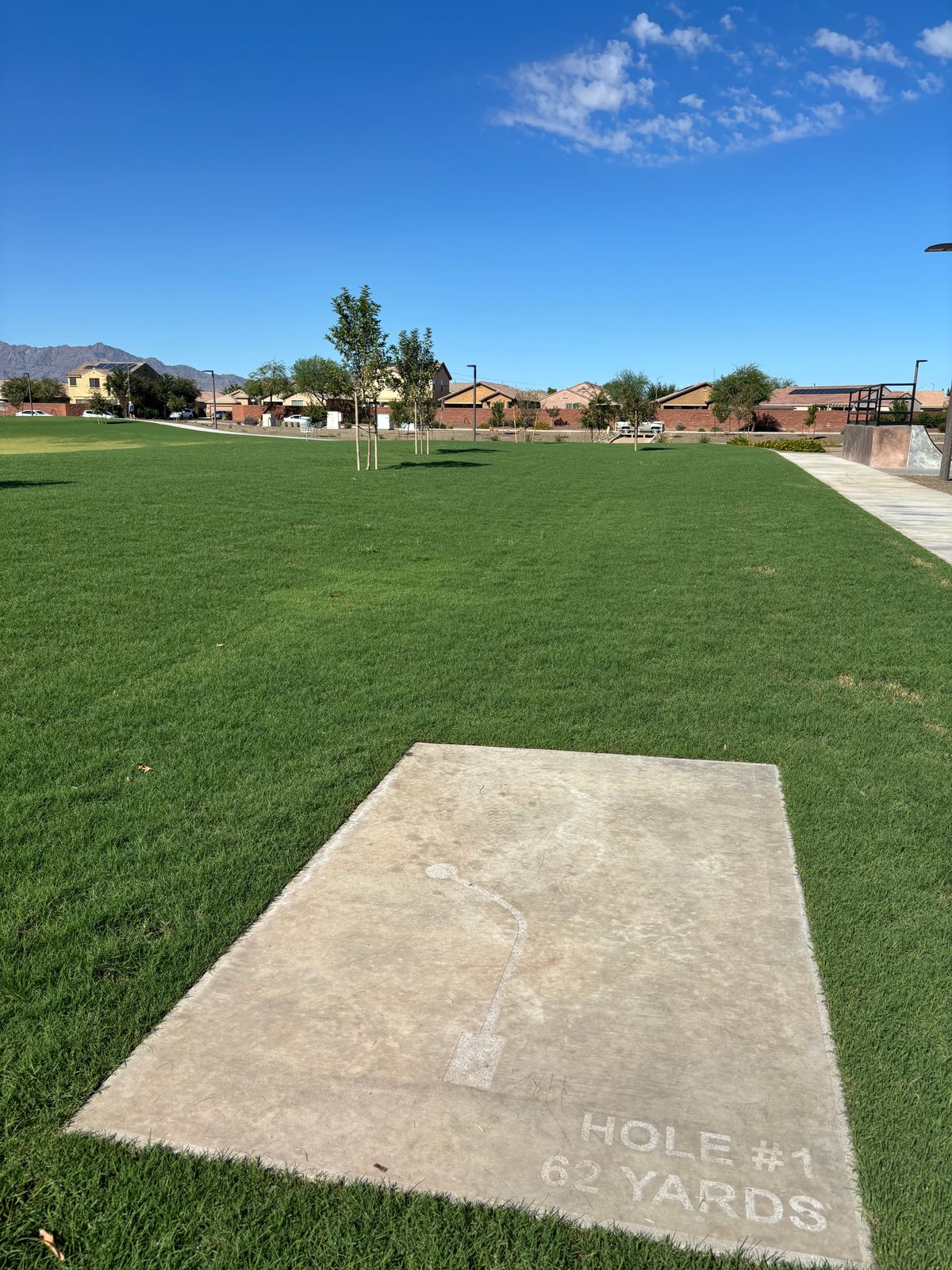 Mando right, first tree on left. Sidewalk, rock boarder & beyond OB