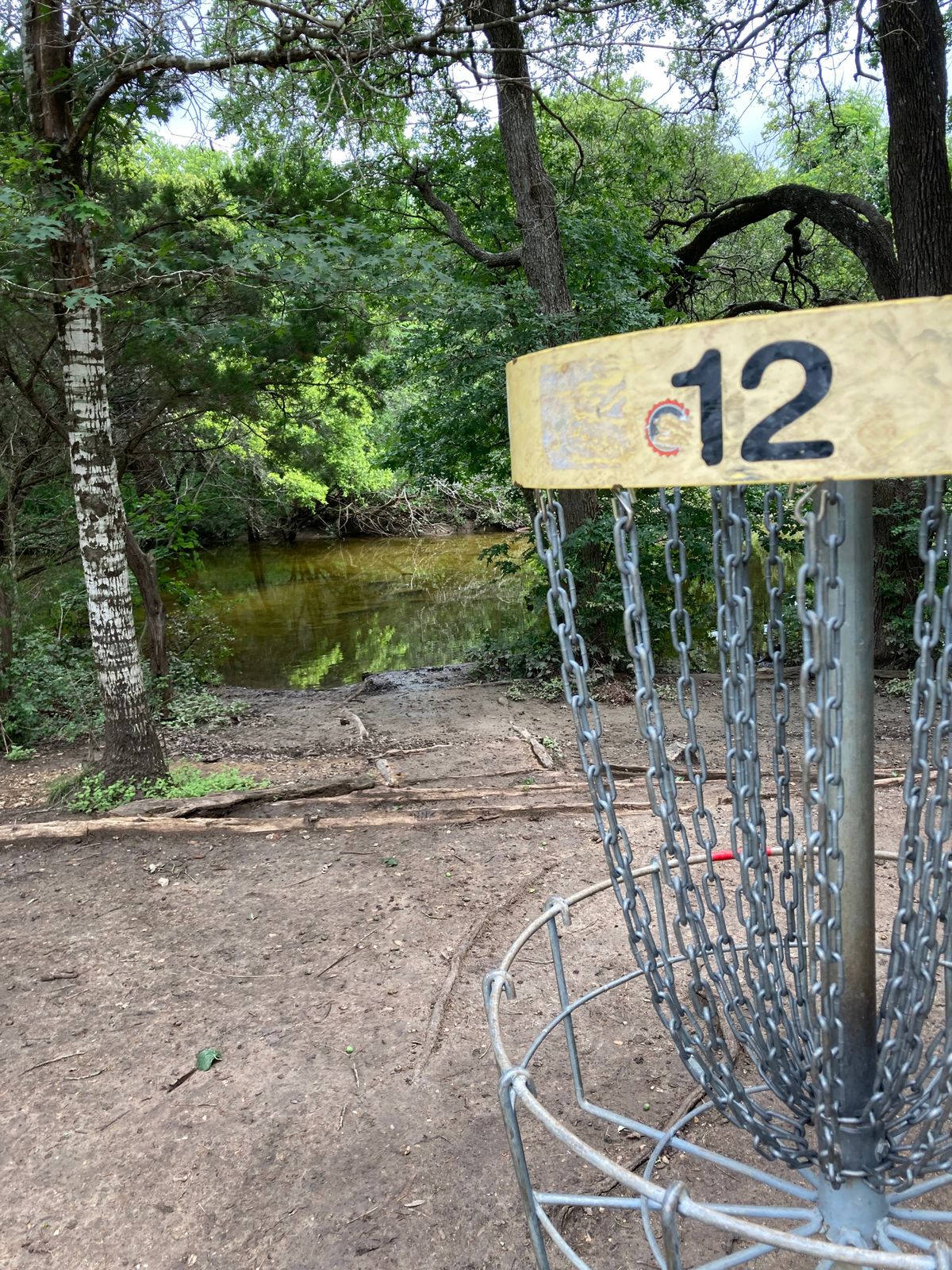 Sometimes the creek is full of water. (Not all the time) If it is dry walk across it to the next hole.