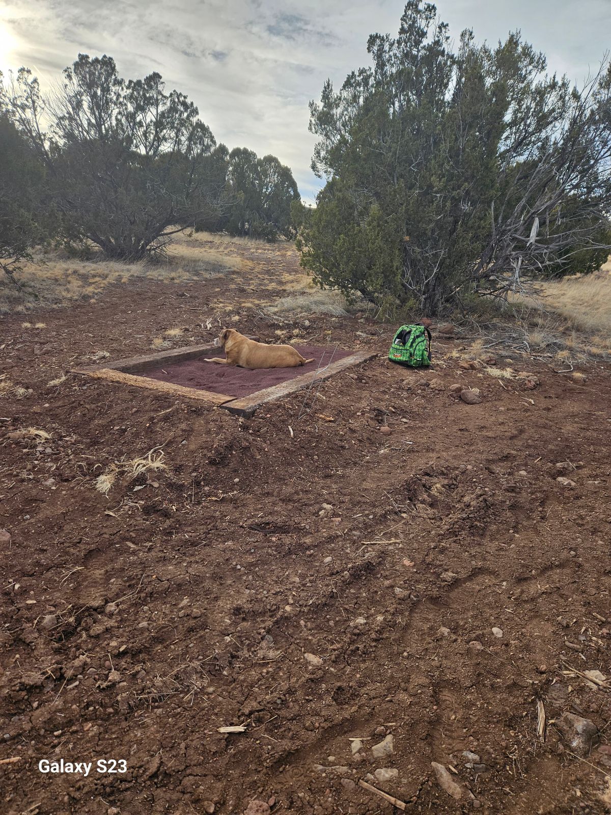 Railroad ties and small cinder the pads, for now.