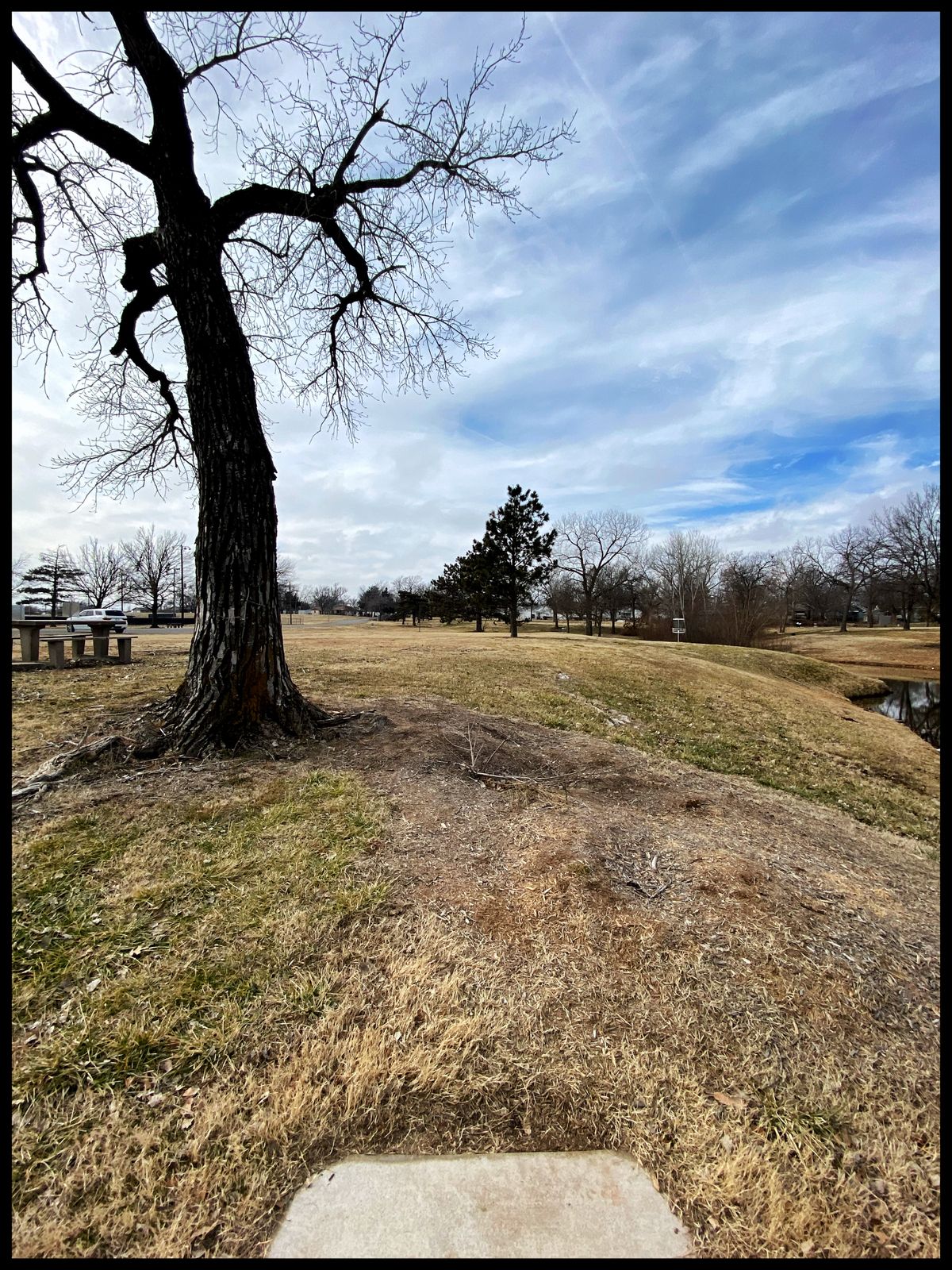 #1 Tee throwing west-off to left- basket to right is #18