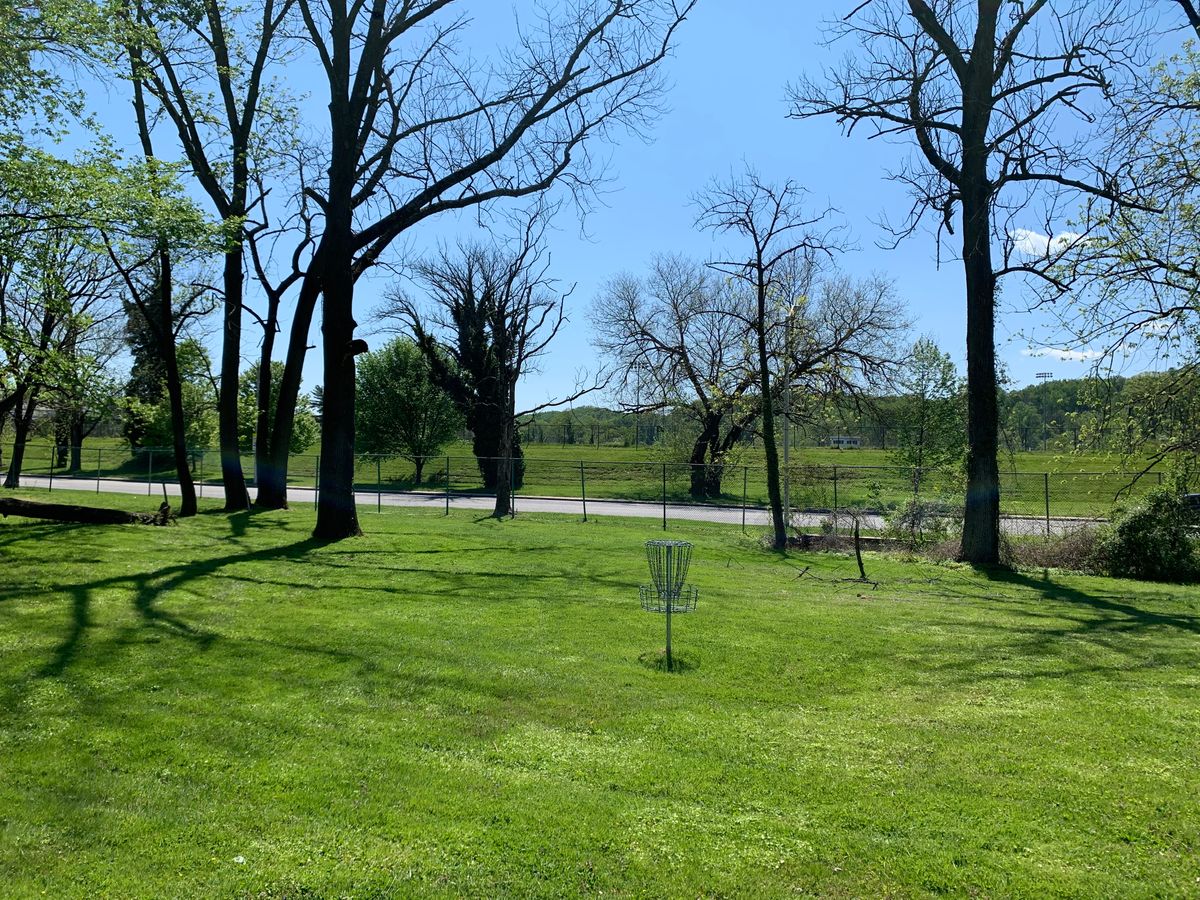 Hole 3 basket. Falls road is on the other side of the fence.