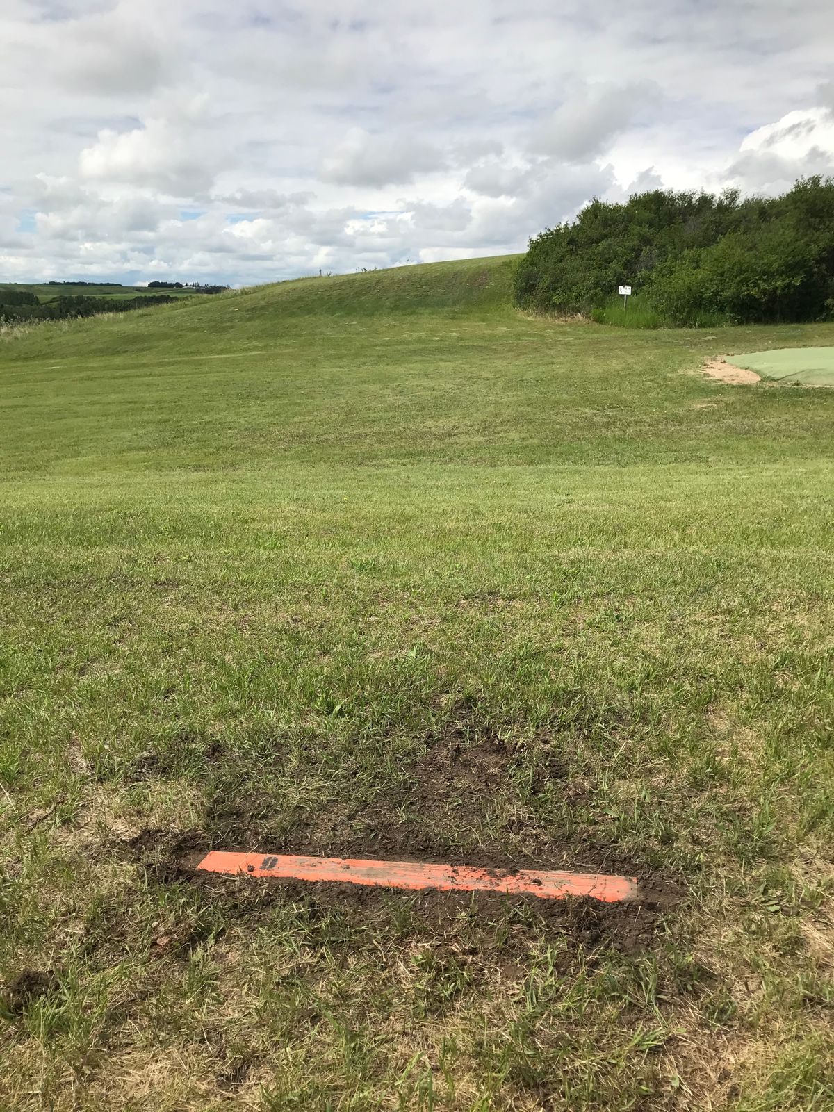 Hole 9. Dog leg right on the open space at the top of the hill.