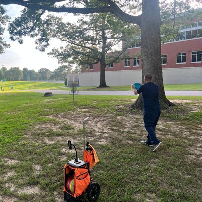 Anthony putting on hole 3 basket.