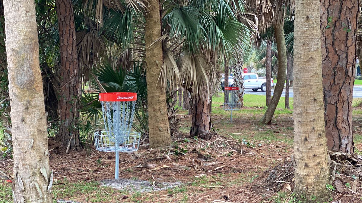 Hole 1's basket, with hole 3's basket luring in the background.