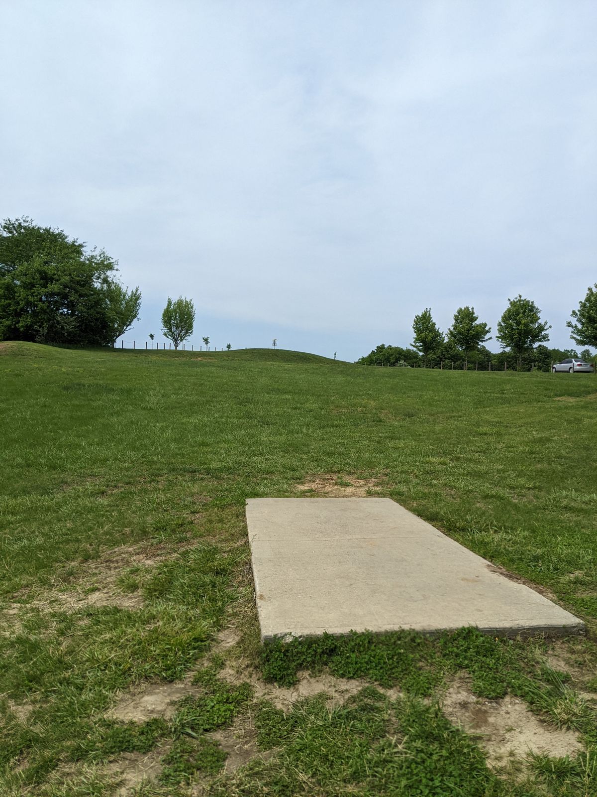 Hole 1 teepad. Basket is on the hill.