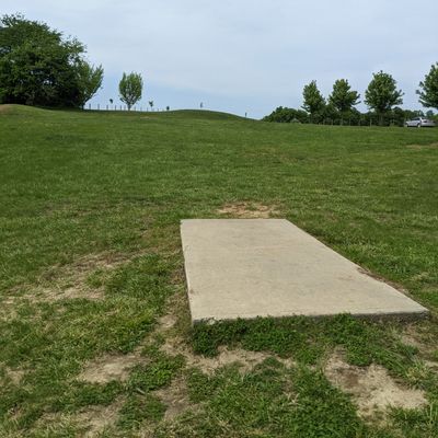 Hole 1 teepad. Basket is on the hill.