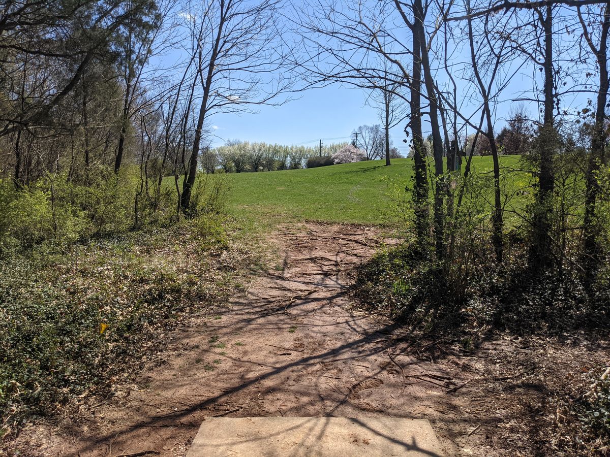 Hole 13 requires a good shot to get out of the initial gap but offers little difficulty once clear.  The hole plays slightly uphill.