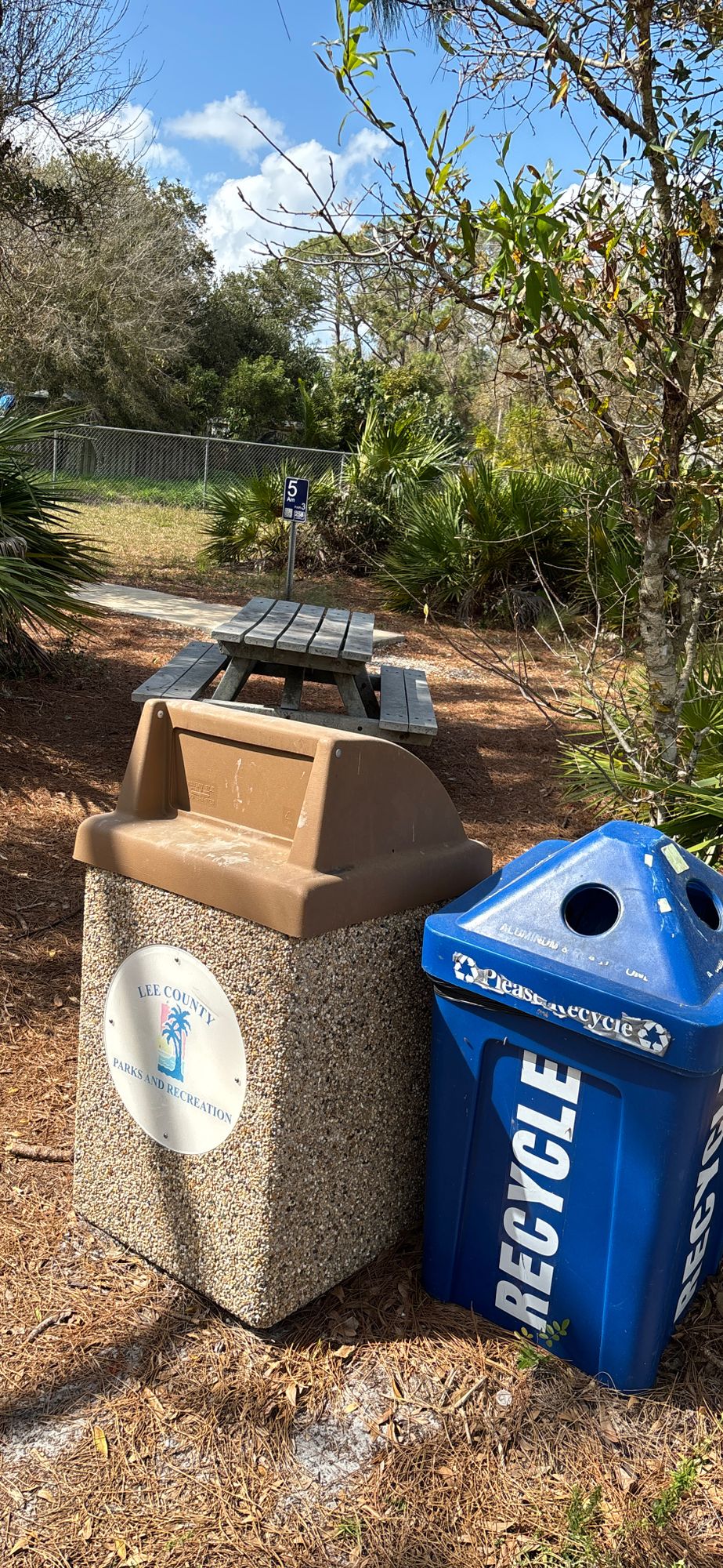 Trash cans, recycling, and benches throughout
