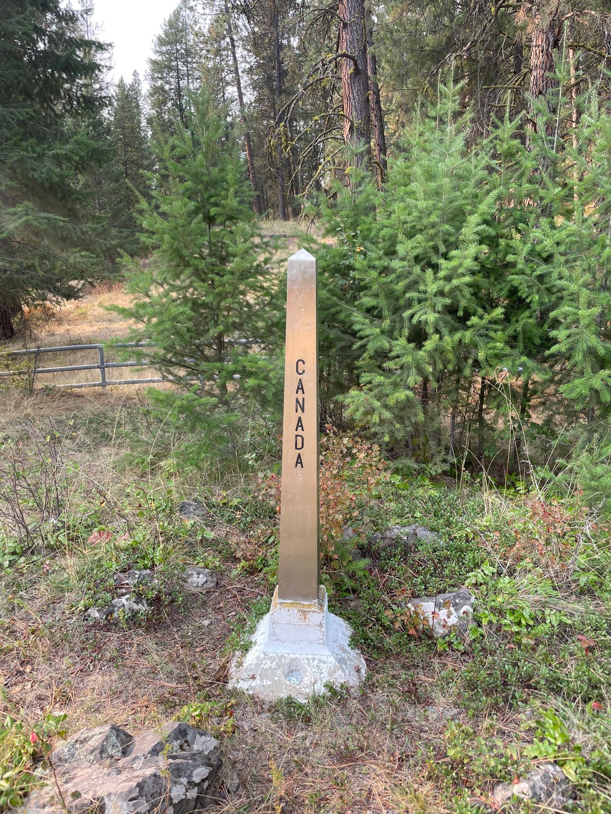 Canada/USA border marker nearby on the course