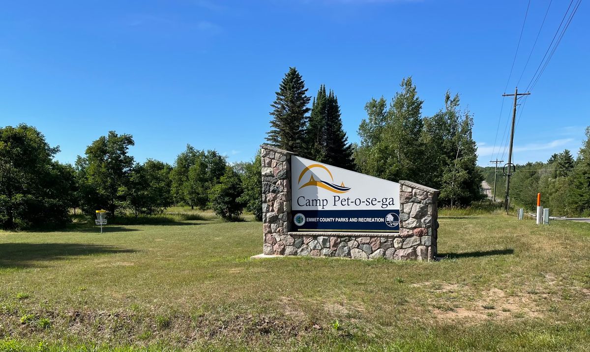 15’s basket behind the entrance sign. 

Your almost there, turn down Camp Pet-O-Se-Ga Rd and parking is just ahead around the curve