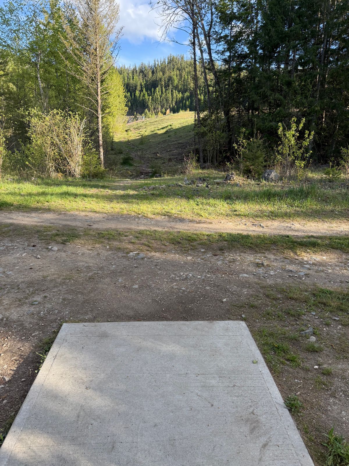 Hole on with green on steep slope