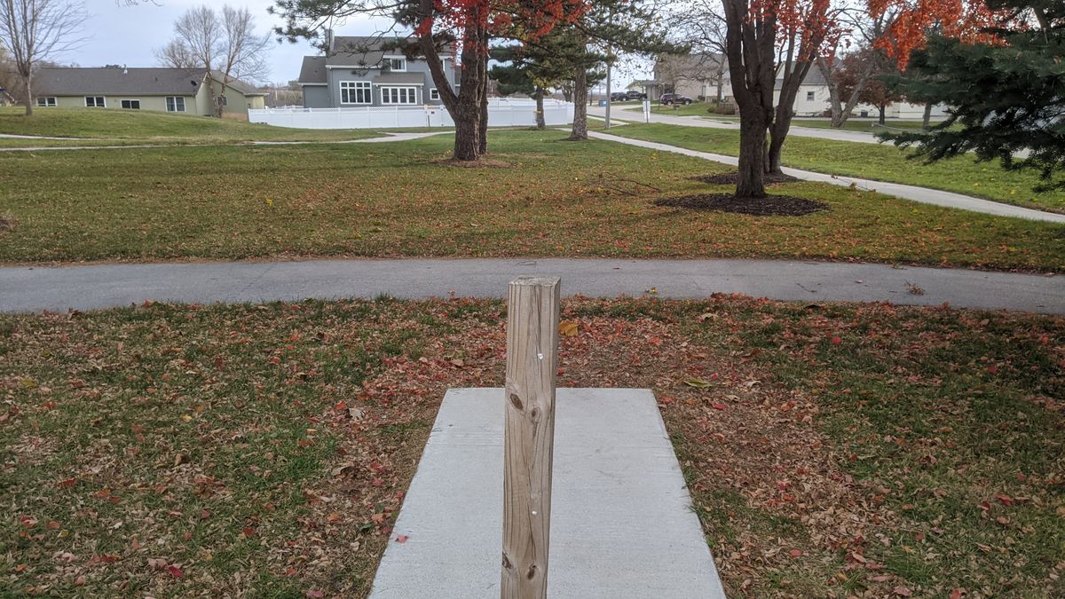 Tee #1. (Basket in line with post down by last tree)