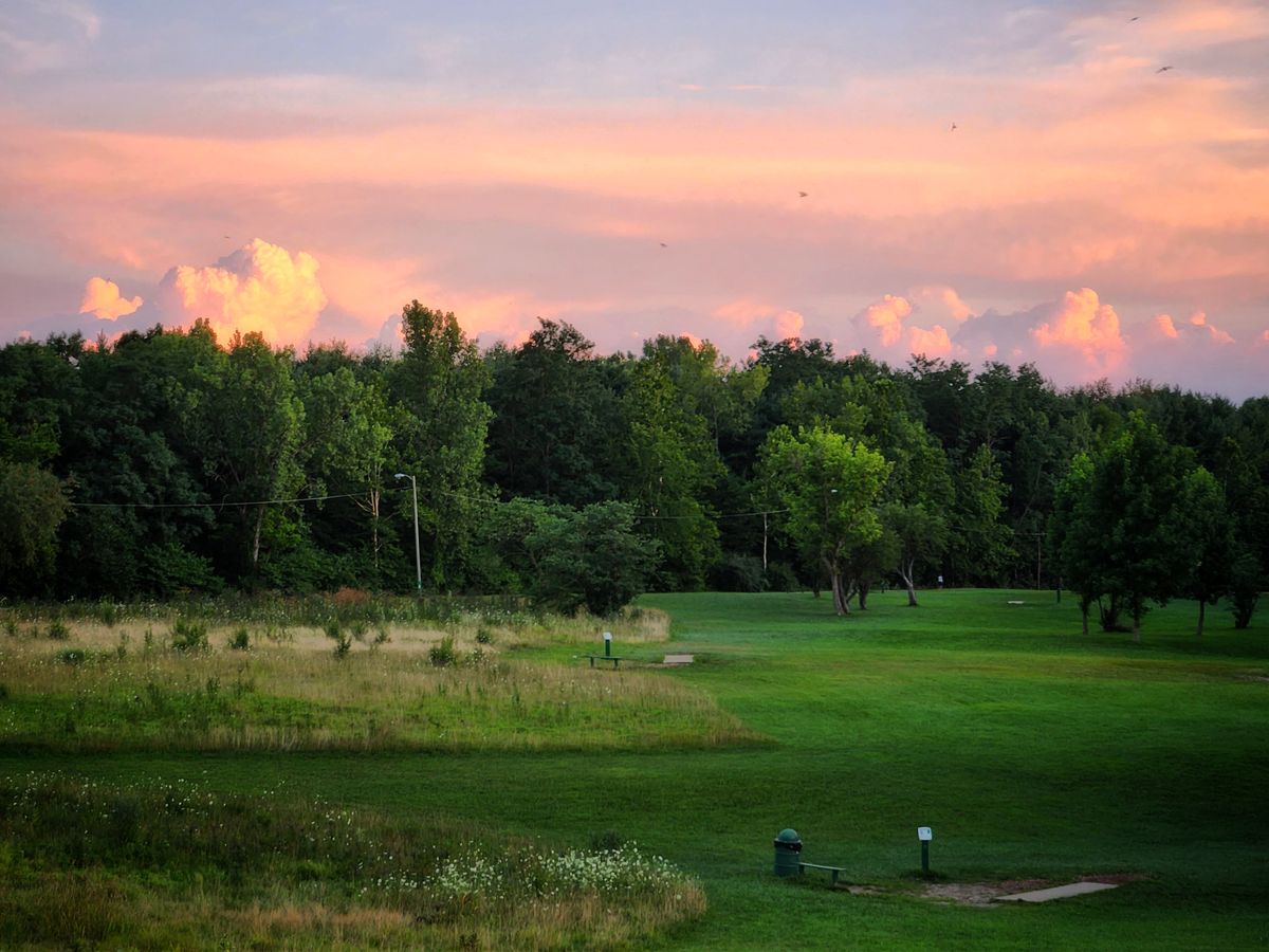 From the high path between holes 1 and 2.  Showing here are short or shared tees for holes 3, 5 and 6.  Gorgeous sunset with birds flyin' 😀