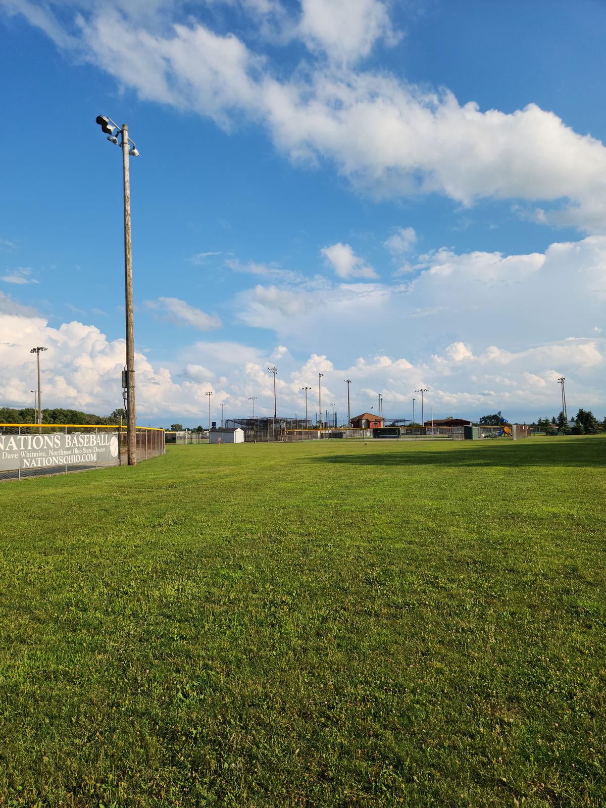 View of hole 18 from the tee. The mando light pole is seen to the left