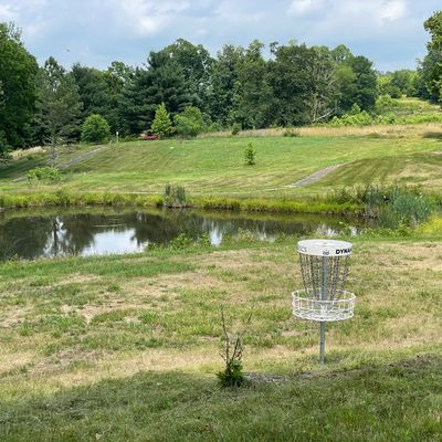 Behind basket looking back at tees