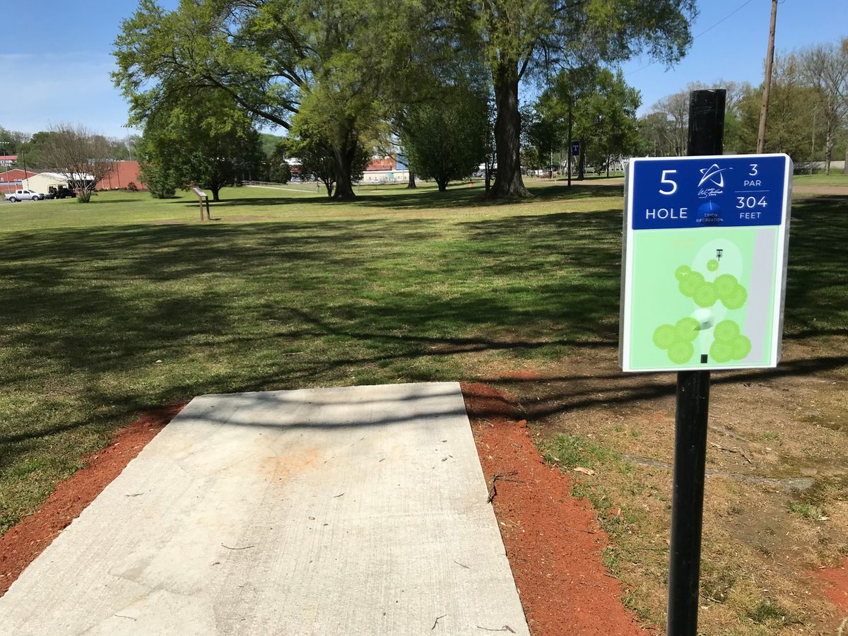 No. 5 tee box. Basket straight behind trees.