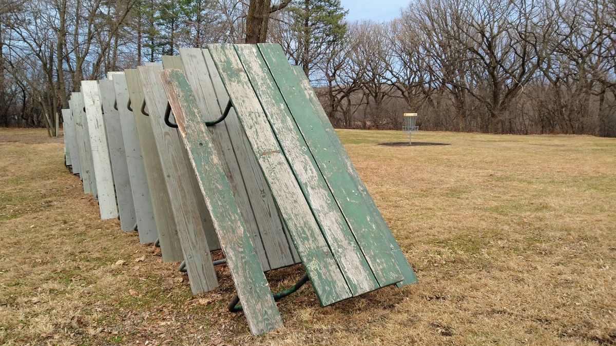 Hibernating Picnic Tables serve as backstop for Hole 2 as Winter comes.