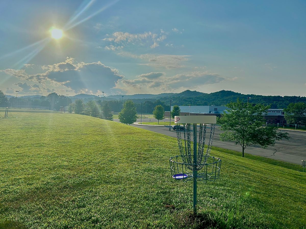 Hole 6 basket with bluffs behind
