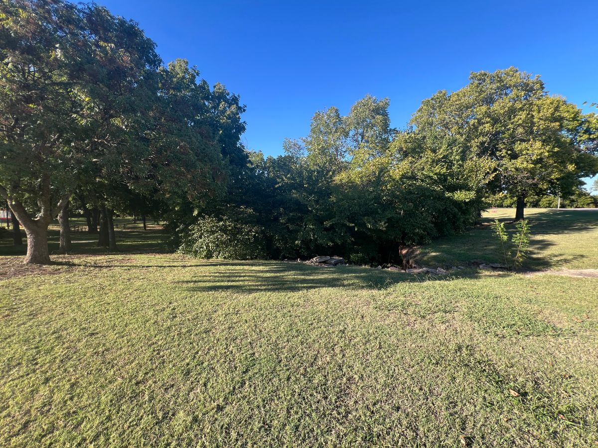 The tee off of hole 8 (left) over the creek twice, and into the basket (right, in between the trees)
