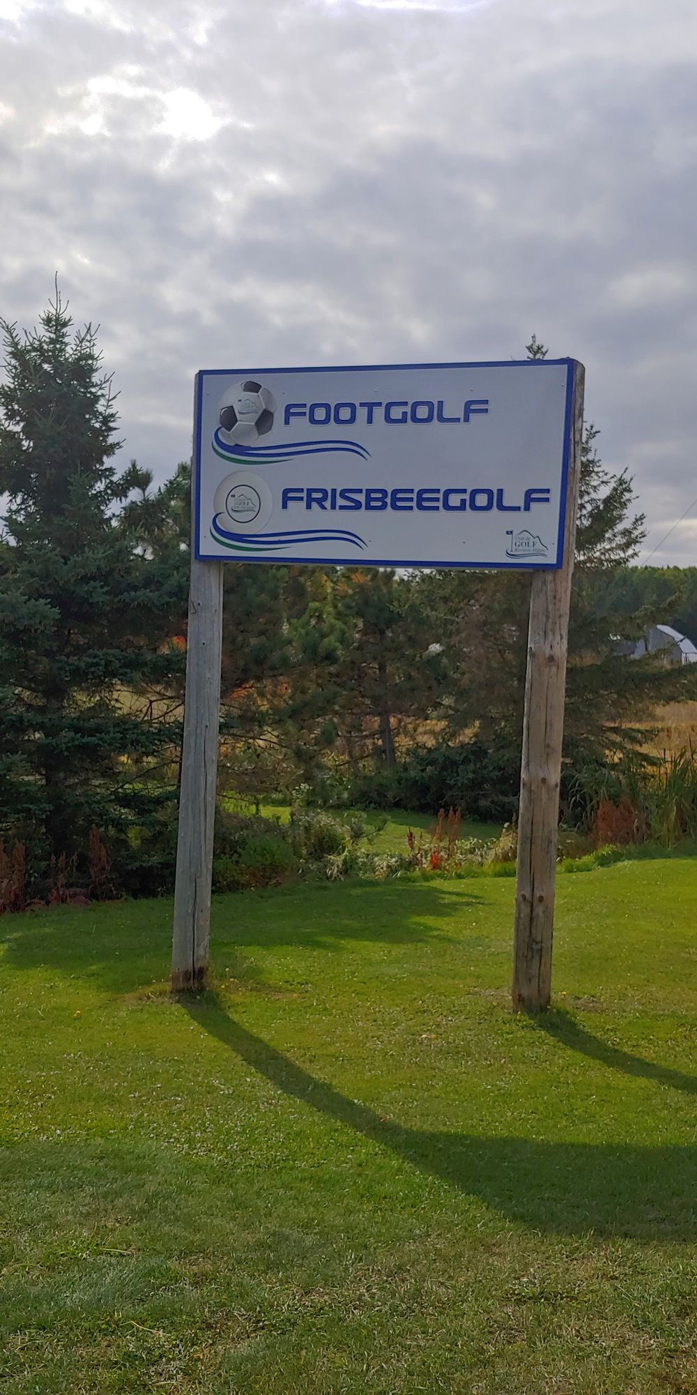 Not on the golf course, next to a field on the other side of the road. No great view.