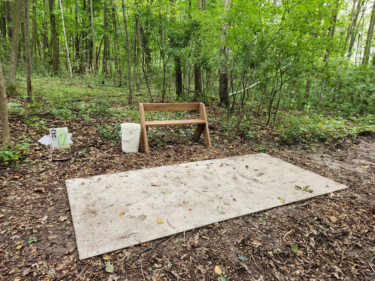 Benches and garbage pails at all tees