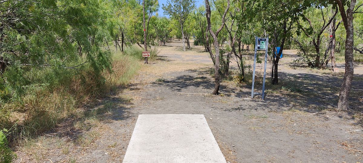 Hole 16 tee pad. Mando on the left.