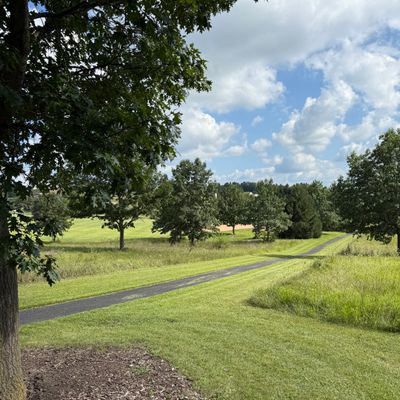 Hole 3 tee area by picnic shelter looking downhill toward hole 3 basket