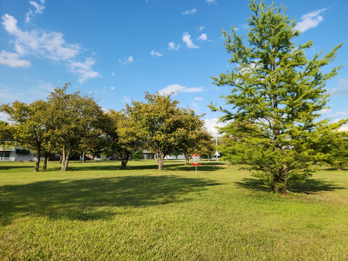 View of hole 12's green from left side of fairway