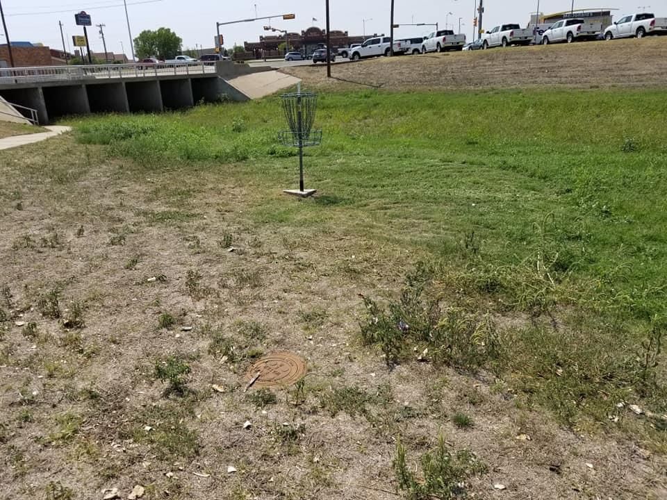 Hole 8 behind bill Allison car lot.