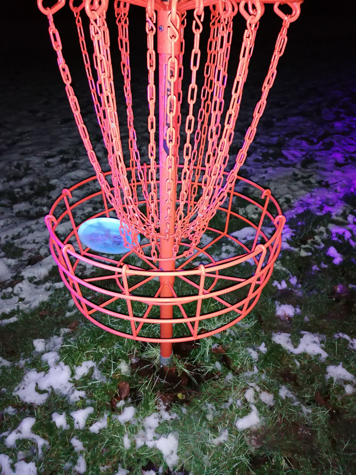 Hole 2 basket at night.