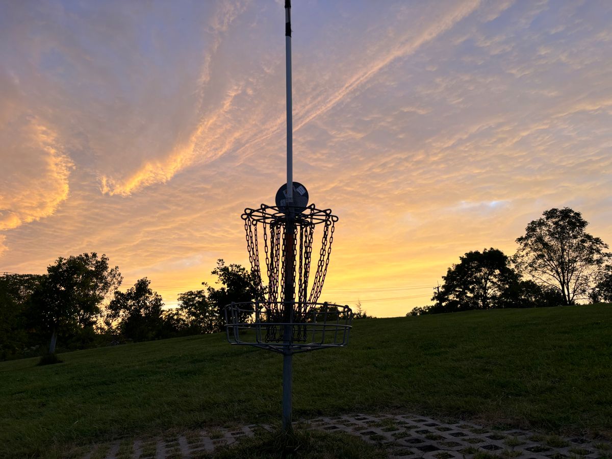 Putting back up the hill and into the sunset on hole #3