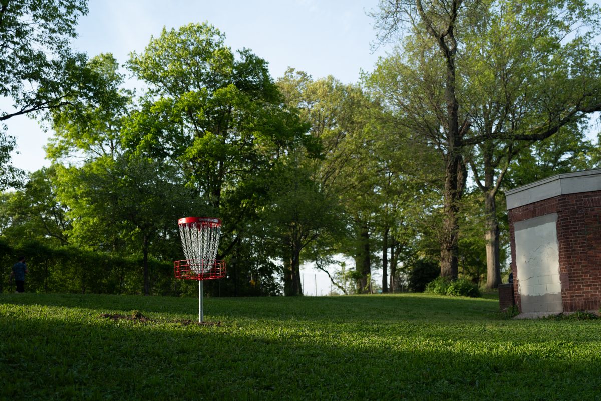 Hole 4 basket with old rose garden building