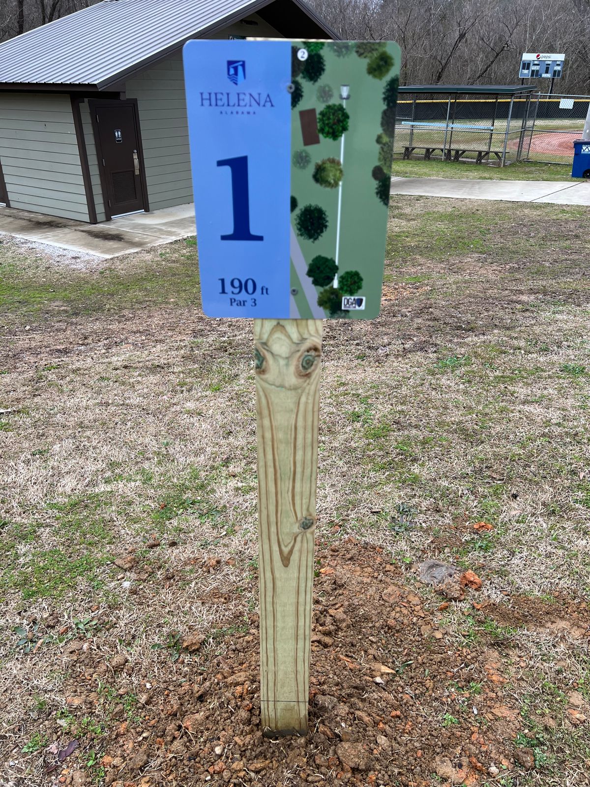 Starting hole is up the path from the baseball field and right of the tennis courts.