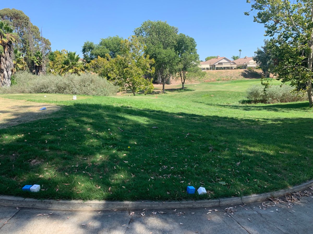 Omega Hole 12 Tee