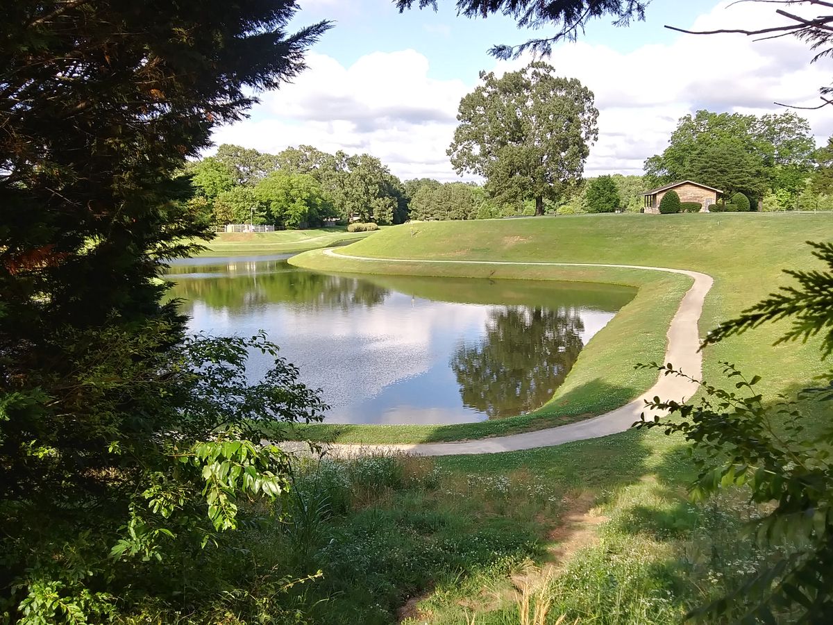 Spectacular view with a challenging downhill throw. The basket is across the water on close to a 45 degree angle slope.