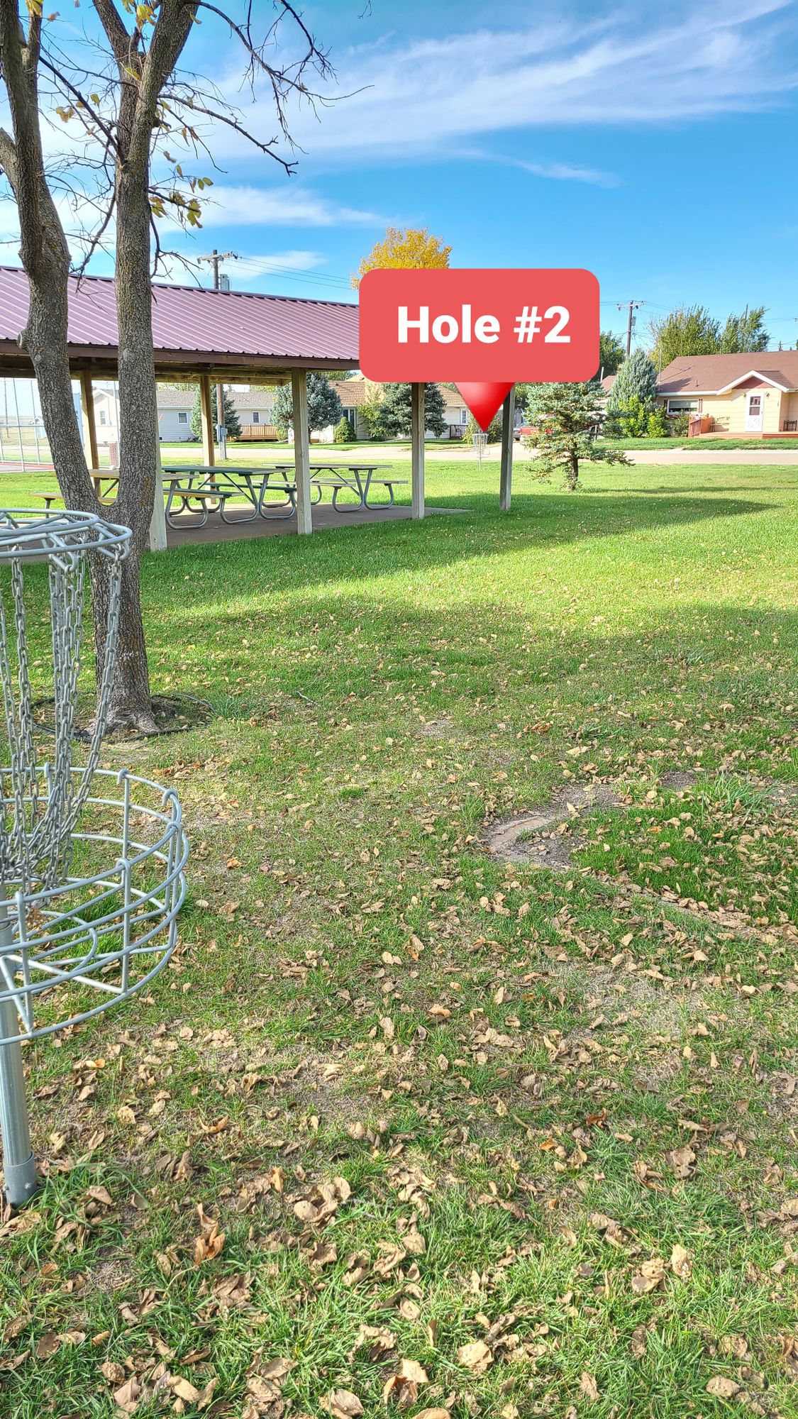 Hole 2, hyzer around the pavilion.