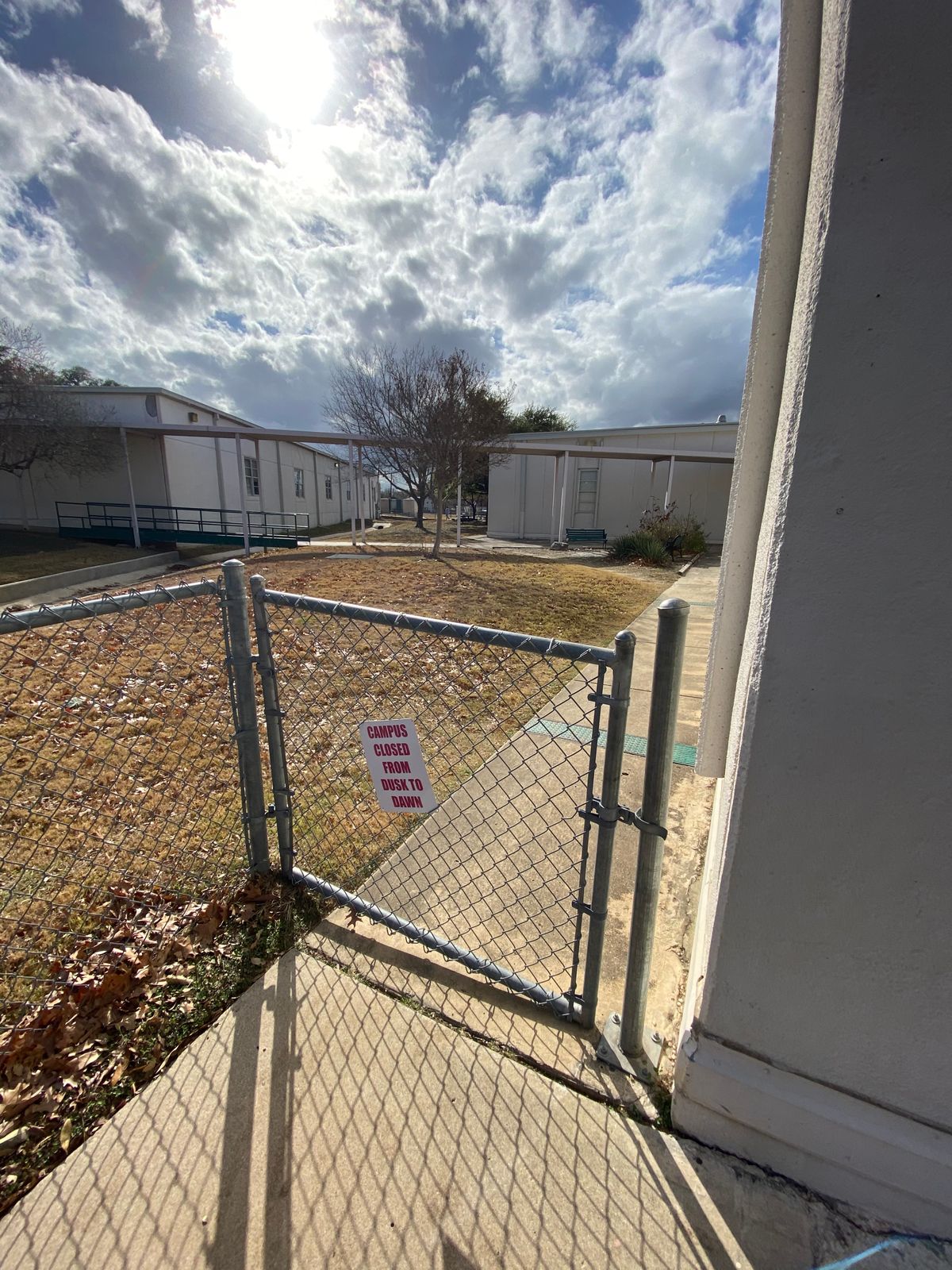 After following the sidewalk, you find this gate which will lead you to the course. Good luck!