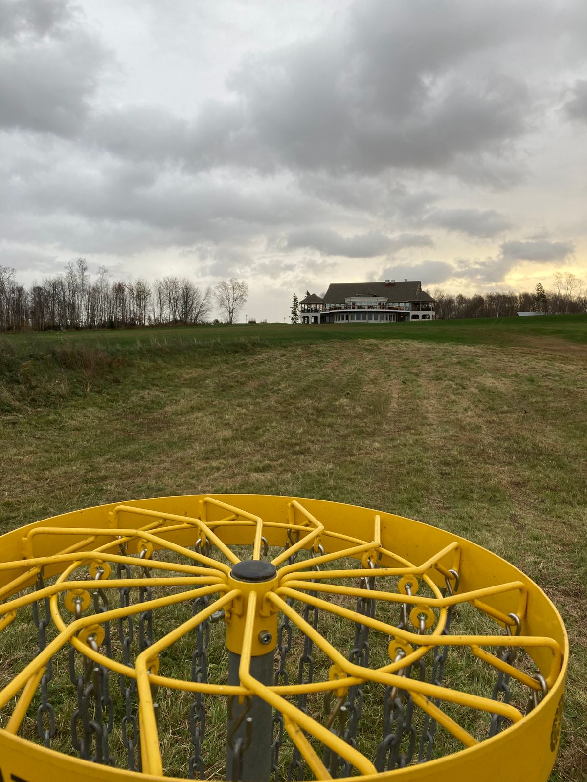 Basket of Hole 9 facing the Fox Meadow clubhouse and Hole 10’s tee pad (left of clubhouse)