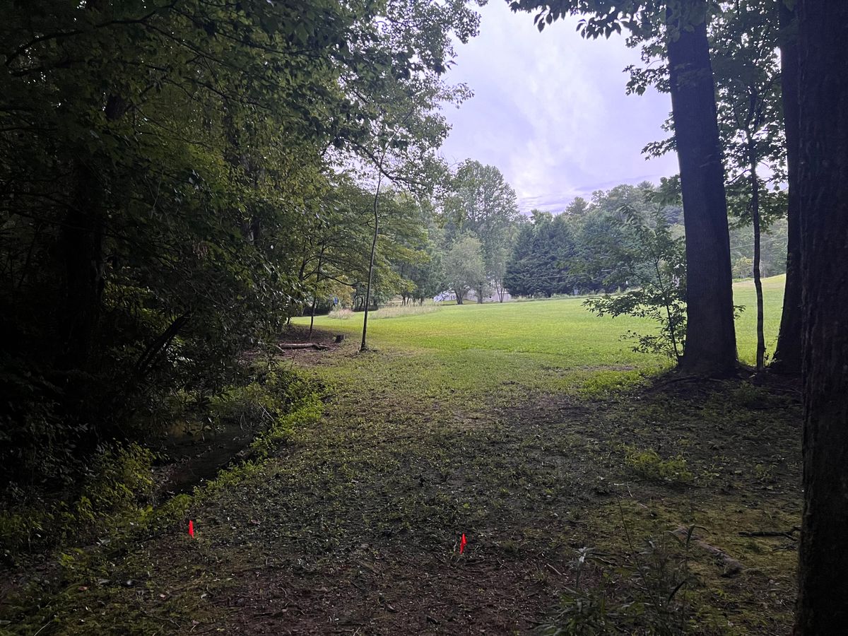 Hole 3 tee pad. Avoid the OB onto the island.