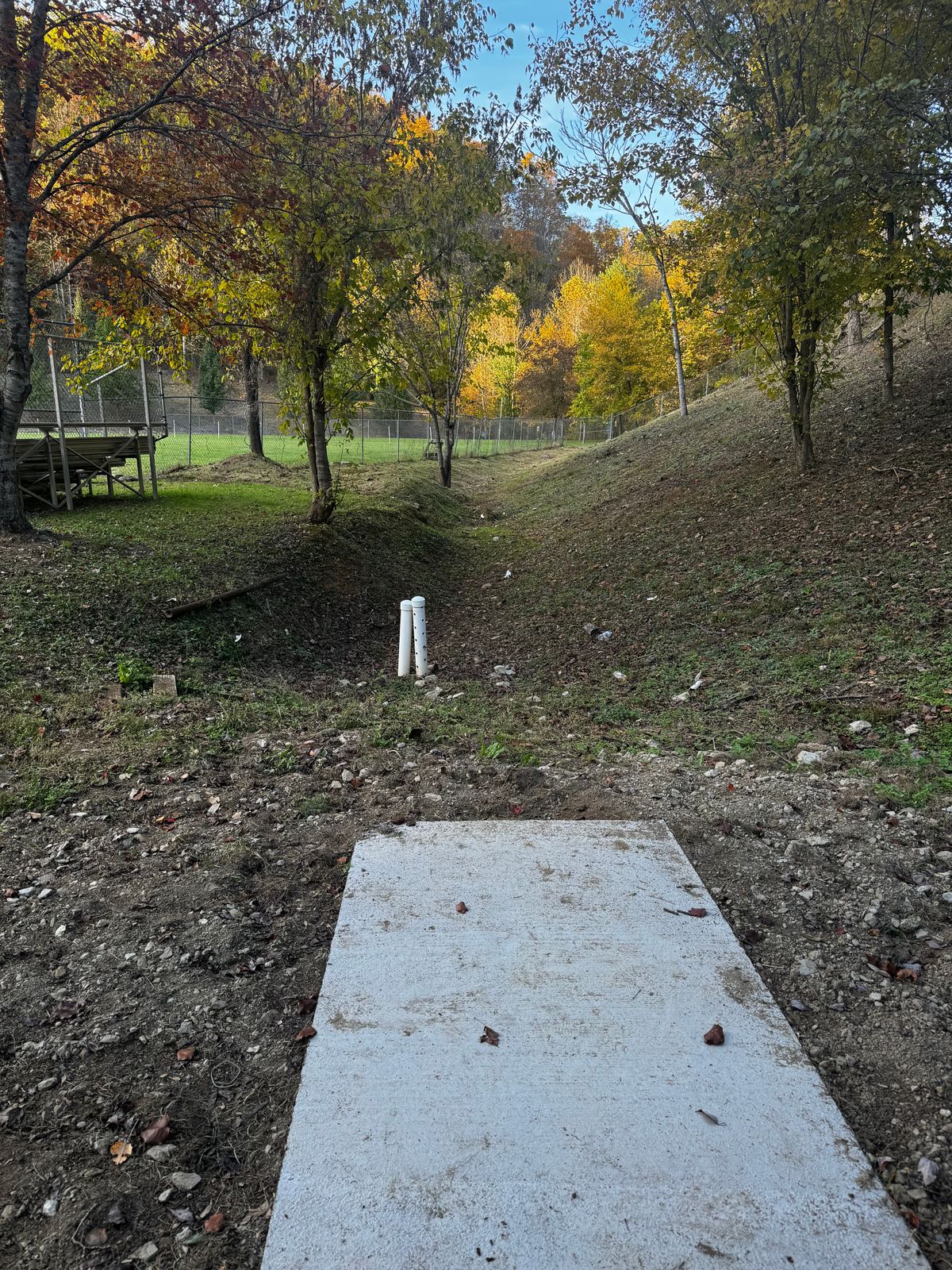 Hole 1 - start behind home plate of ball field.