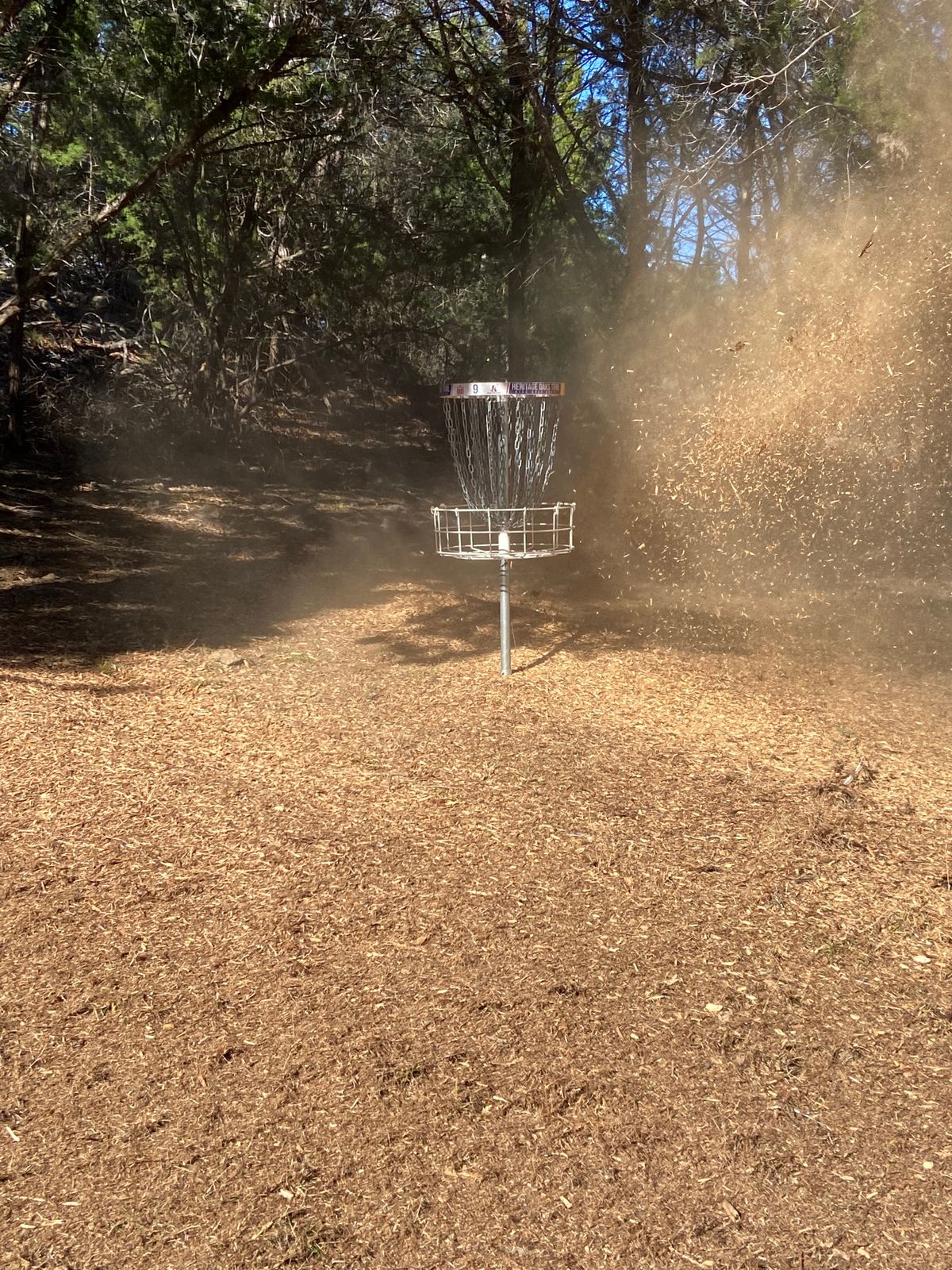 Spraying some mulch on #9 basket.