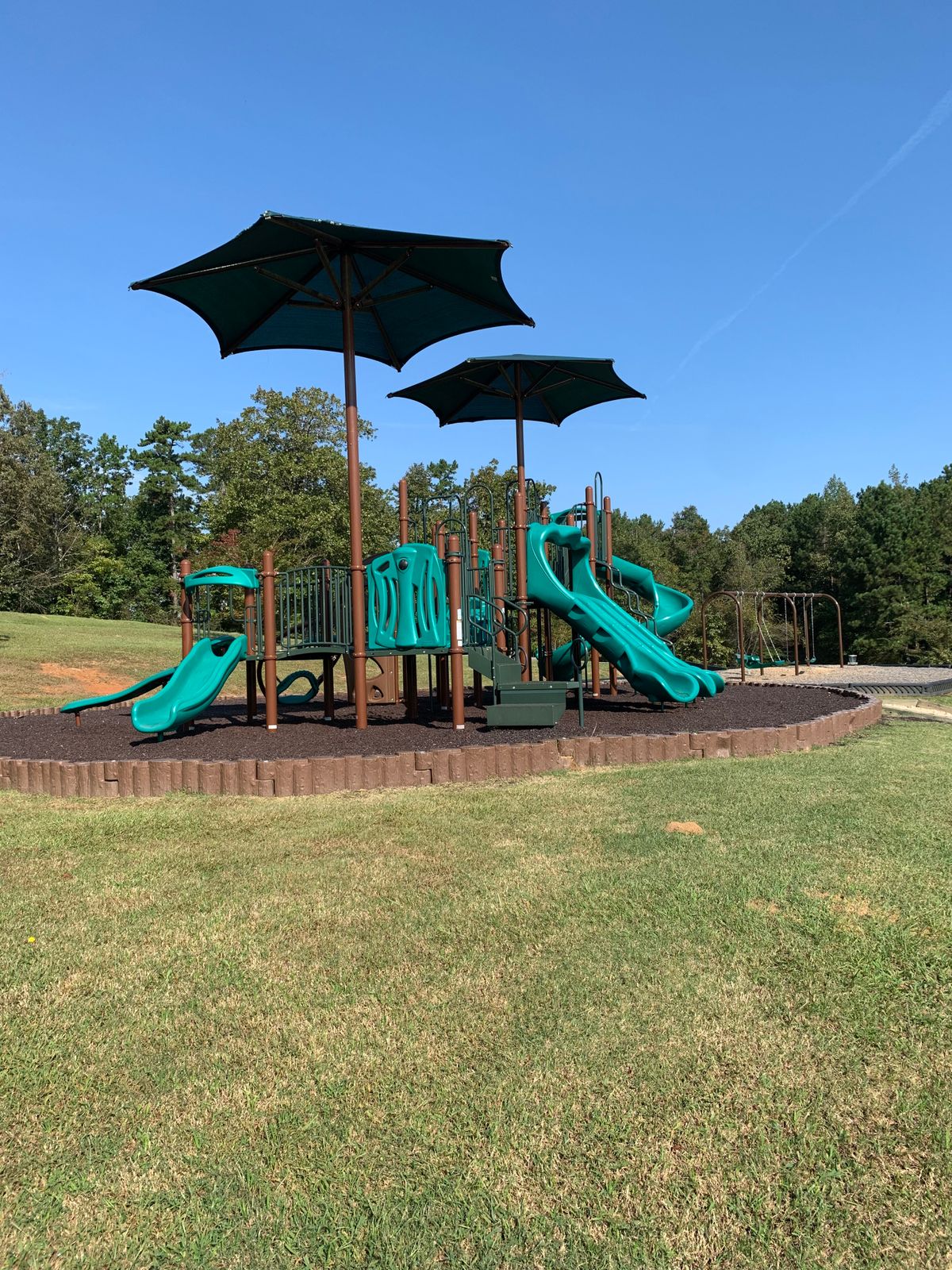 Nice playground in the middle of course. You play around it.