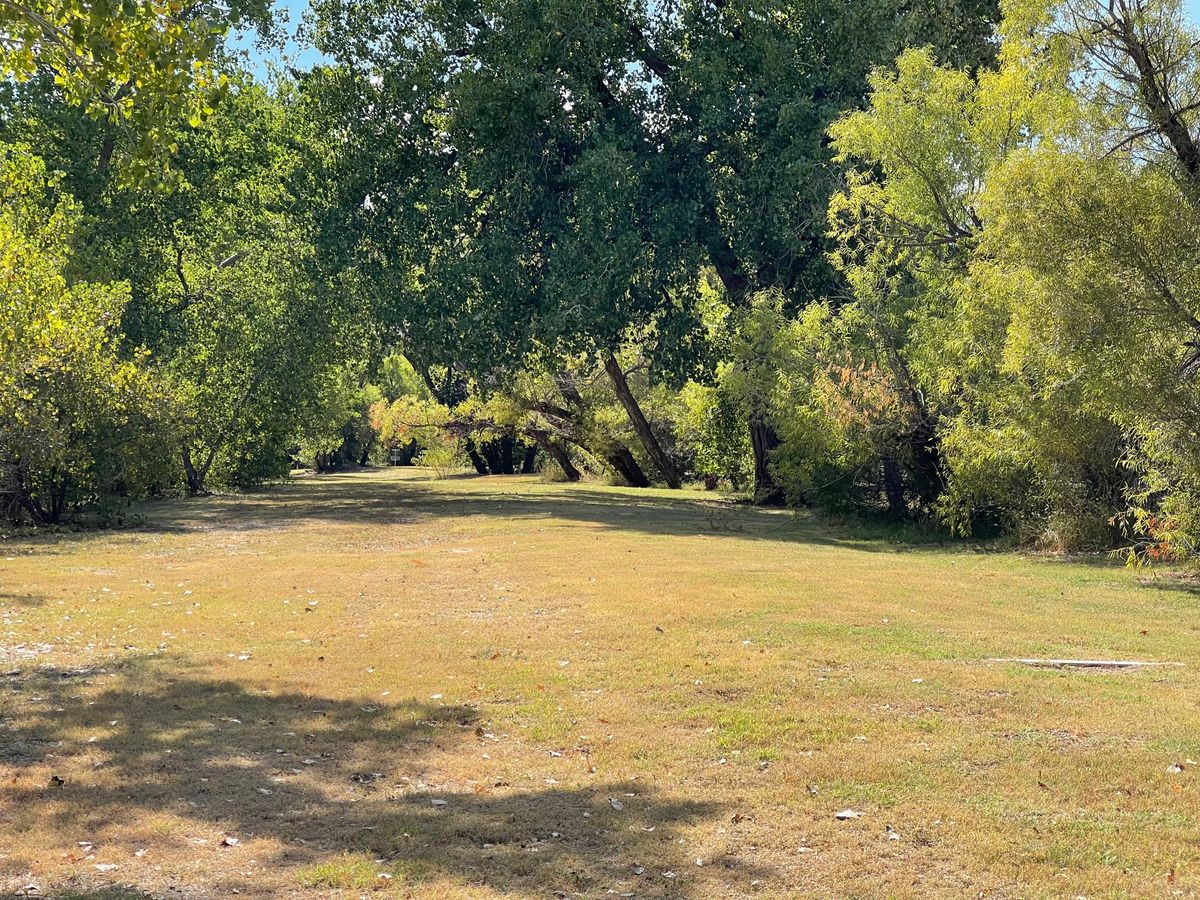 Tunnel Fairway from 7 Long. Water along the left side.