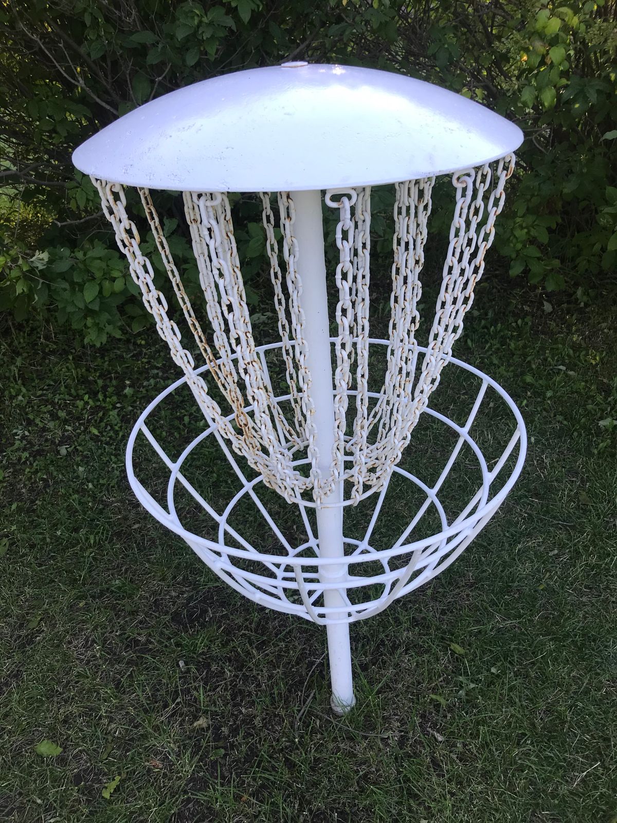 Typical style of metal chain baskets. These are fairly good, but that domed roof sails missed putts!