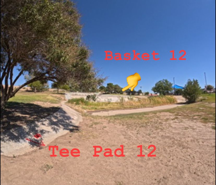 Tee Pad 12. Play 10 ft to the right of concrete. OB plays drop penalty on tee pad 2.