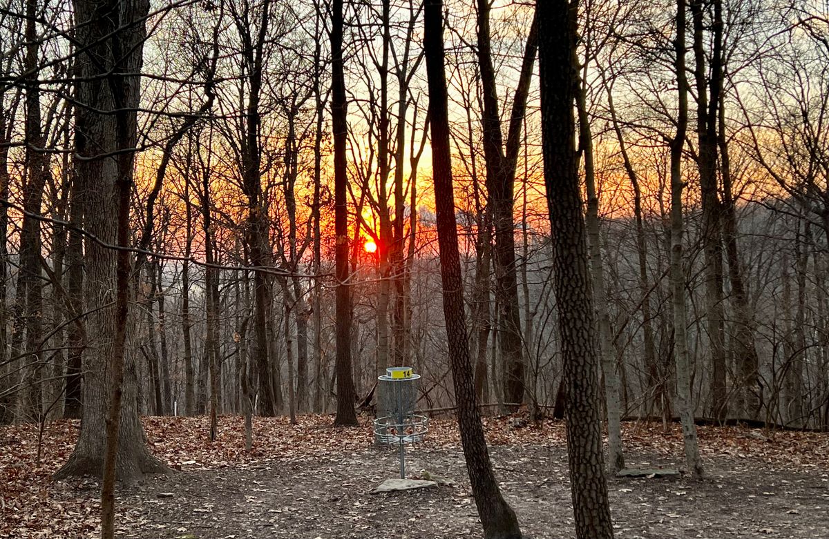 Hole 14 with the Mississippi River and sunset in the background
