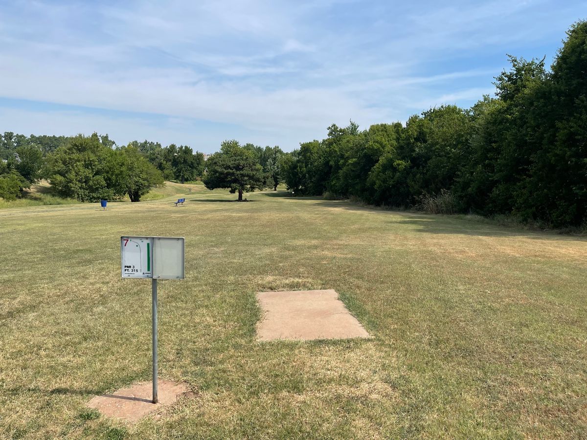 Hole 7 - 315ft Par 3. Slightly down hill, plays short. Can lose discs in trees on the right side.