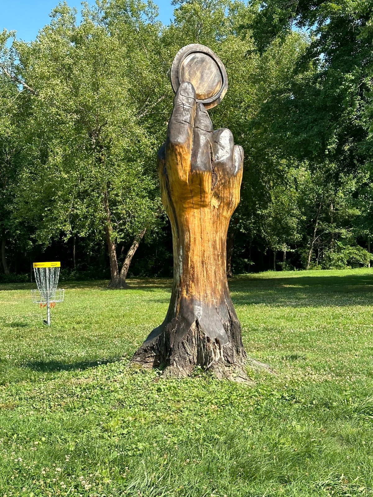 Someone has some mad carving skills to make the sculptures from old tree stumps!  Very cool course!